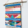 close-up of handwoven wall hanging